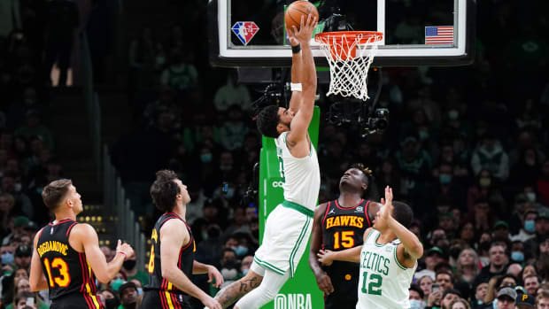 Mar 1, 2022; Boston, Massachusetts, USA; Boston Celtics forward Jayson Tatum (0) makes the basket against the Atlanta Hawks in the second quarter at TD Garden.